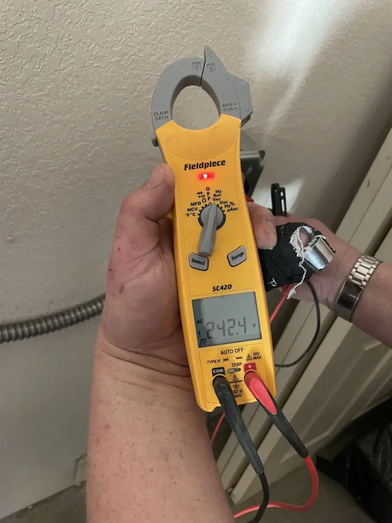 Voltage testing with clamp meter during Generator Installation in Los Fresnos